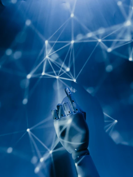 A robotic hand reaching towards a polygon network projection