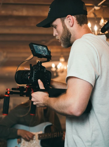 A man operating a video camera