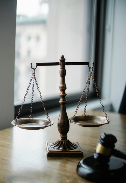 A set of scales and a judges gavel representing the legal sector