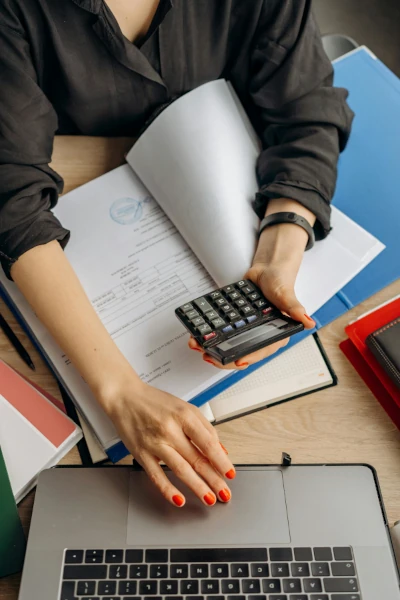 An accountant examining documents representing the finance sector